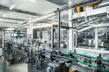 Automated bottling and packaging line in a manufacturing facility